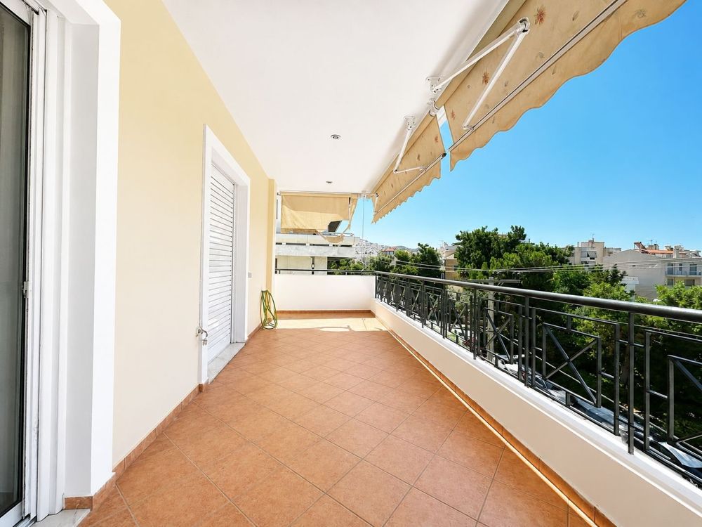 Wide balcony with awnings in Glyfada Downtown