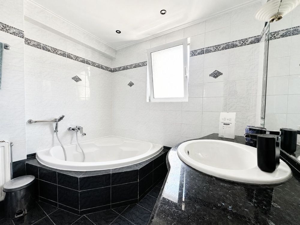 Bathroom with corner bathtub